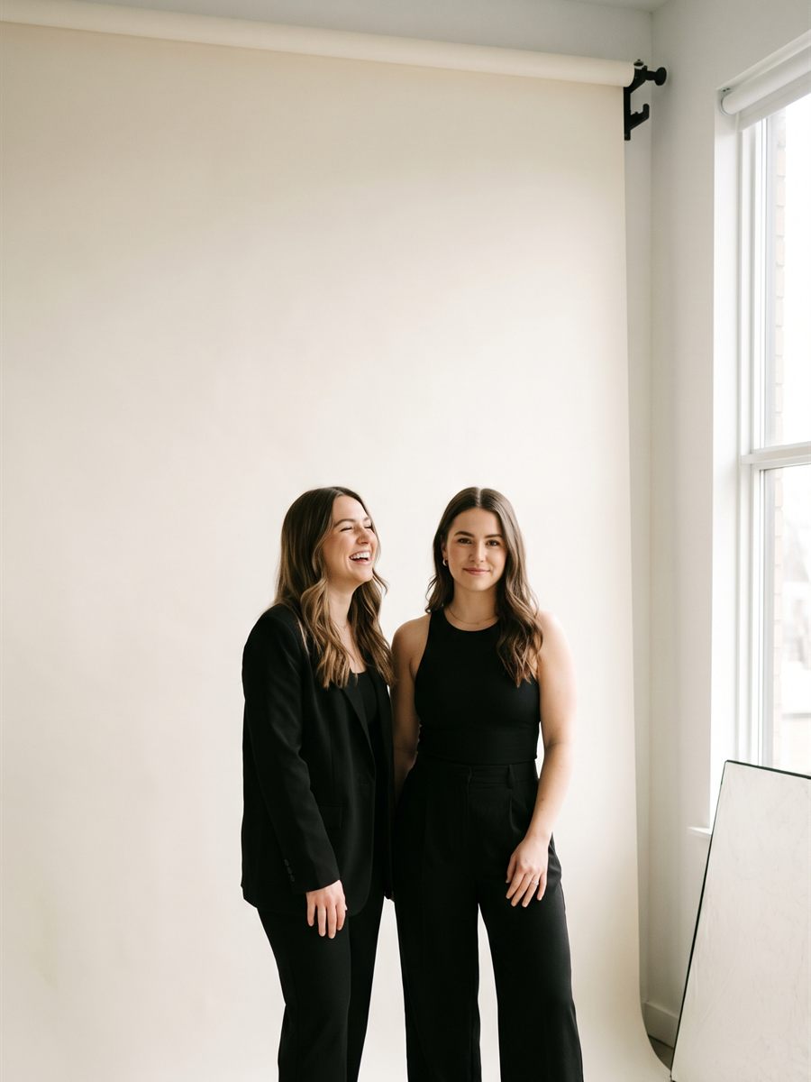 Two Talento Persona digital creators photographed together in an editorial studio setting