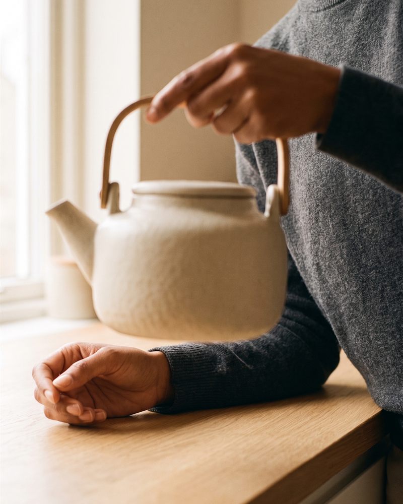 Digital creator Noor demonstrating a product on a kitchen counter